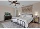 Well-lit primary bedroom with a king bed and modern furnishings at 8971 Majesty Palm Rd, Kissimmee, FL 34747