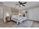 Comfortable bedroom with ceiling fan, neutral walls, and decorative rug at 8971 Majesty Palm Rd, Kissimmee, FL 34747