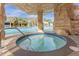 This community pool has a built-in hot tub with a beautiful waterfall feature at 8971 Majesty Palm Rd, Kissimmee, FL 34747