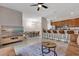 Living room with breakfast bar, and open access to kitchen and dining area at 8971 Majesty Palm Rd, Kissimmee, FL 34747