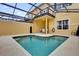 Relax and enjoy your private screened-in pool with table and chairs at 8971 Majesty Palm Rd, Kissimmee, FL 34747