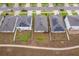 Aerial view of neighborhood homes with solar panels and green lawns in a residential community at 9012 Tuscan Cypress St, Kissimmee, FL 34747
