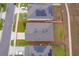 Aerial view of a home showcasing the fenced backyard in a residential neighborhood at 9012 Tuscan Cypress St, Kissimmee, FL 34747
