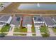 Aerial view showcasing the property's location near a pond in a residential neighborhood at 9012 Tuscan Cypress St, Kissimmee, FL 34747