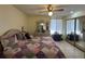 Bedroom featuring a ceiling fan, dresser, and a large closet at 996 Dolphin Dr, Winter Garden, FL 34787