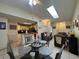 Inviting dining area with a round glass table, chairs, and a view into the living room and kitchen at 996 Dolphin Dr, Winter Garden, FL 34787
