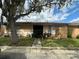 Charming single-story home with a well-manicured lawn and mature tree, offering shade and curb appeal at 996 Dolphin Dr, Winter Garden, FL 34787