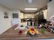 Well-lit kitchen with a breakfast bar and stainless steel appliances at 996 Dolphin Dr, Winter Garden, FL 34787