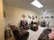 Bright and airy living room with tile floors, comfortable seating, and a skylight providing natural light at 996 Dolphin Dr, Winter Garden, FL 34787