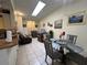 Open-concept living space showcasing tile flooring and a dining area that seamlessly connects to the kitchen at 996 Dolphin Dr, Winter Garden, FL 34787