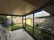 Enclosed patio with view of backyard, includes a shed for storage and mature landscaping at 996 Dolphin Dr, Winter Garden, FL 34787