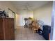 Spare room featuring tile flooring, a ceiling fan, and mirrored closet doors at 996 Dolphin Dr, Winter Garden, FL 34787