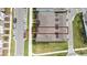 Birds eye view of townhomes showcasing rooflines, green spaces, and parking areas at 10414 Folly Beach Rd, Orlando, FL 32827