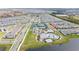 Extensive aerial view of a residential community, showcasing amenities, streets, and housing at 10414 Folly Beach Rd, Orlando, FL 32827