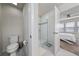 En-suite bathroom features a shower, toilet, and neutral decor at 10414 Folly Beach Rd, Orlando, FL 32827