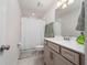 Well-lit bathroom with a shower-tub combo, vanity, and modern fixtures at 10414 Folly Beach Rd, Orlando, FL 32827