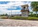 Stone entrance and signage for Isles of Lake Nona community with lush landscaping and water feature at 10414 Folly Beach Rd, Orlando, FL 32827