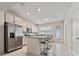 Bright kitchen with stainless steel appliances, granite countertops, and a center island with seating at 10414 Folly Beach Rd, Orlando, FL 32827