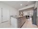 Kitchen island with granite countertops and casual seating, great for entertaining at 10414 Folly Beach Rd, Orlando, FL 32827