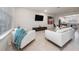 Bright living room features tile flooring, modern furniture, and an open concept design at 10414 Folly Beach Rd, Orlando, FL 32827