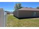 Side view of house with a lush green lawn at 138 Inconnu Ct, Kissimmee, FL 34759