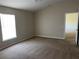 This bedroom is carpeted and has neutral colored walls and a window that provides natural light at 138 Inconnu Ct, Kissimmee, FL 34759