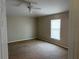 Spacious bedroom featuring carpet flooring, neutral walls, and natural light at 138 Inconnu Ct, Kissimmee, FL 34759