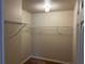Walk-in closet with neutral walls and metal shelving for maximum storage at 138 Inconnu Ct, Kissimmee, FL 34759