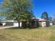 Charming single-story home with a well-maintained lawn and mature tree in a suburban neighborhood at 138 Inconnu Ct, Kissimmee, FL 34759