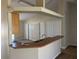 Open kitchen with a peninsula featuring a sink and an open view to an adjacent room at 138 Inconnu Ct, Kissimmee, FL 34759