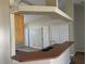 Open kitchen with a peninsula featuring a sink and an open view to an adjacent room at 138 Inconnu Ct, Kissimmee, FL 34759