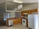Functional kitchen area boasts tile floors, modern appliances, and ample counter space at 138 Inconnu Ct, Kissimmee, FL 34759