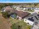 A beautiful home features a screened pool with a backdrop view of a golf course and mature trees at 141 Prestwick Dr, Davenport, FL 33897