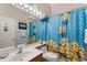 bathroom with Minion-themed shower curtain and bright vanity lighting at 141 Prestwick Dr, Davenport, FL 33897