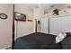 Bedroom with vaulted ceiling and four-poster bed features a wall-mounted TV at 141 Prestwick Dr, Davenport, FL 33897