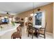 Cozy dining area with natural light, views to living room, and seamless flow to the living spaces at 141 Prestwick Dr, Davenport, FL 33897