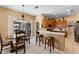 Charming kitchen with breakfast bar seating and adjacent dining area, perfect for casual meals at 141 Prestwick Dr, Davenport, FL 33897