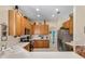 Efficient kitchen layout with stainless steel appliances, plentiful storage, and spacious countertops at 141 Prestwick Dr, Davenport, FL 33897