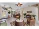 Open floor plan featuring a dining area, living room, and natural lighting throughout at 141 Prestwick Dr, Davenport, FL 33897