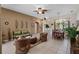 Spacious living room with a seamless transition to dining area, perfect for entertaining and relaxation at 141 Prestwick Dr, Davenport, FL 33897
