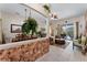 Inviting living space with an open-concept layout, stylish decor, and access to the outdoor pool area at 141 Prestwick Dr, Davenport, FL 33897