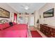 Primary bedroom showcasing a decorative shelf and a dresser with a television at 141 Prestwick Dr, Davenport, FL 33897