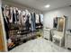 Spacious walk-in closet featuring extensive storage with hanging racks, shelving and organized shoe storage at 18633 14Th Ave, Orlando, FL 32833