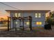 Exterior rear of home with spacious backyard, patio area, and outdoor grill at 2061 S Peninsula Dr, Daytona Beach, FL 32118