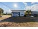 An expansive backyard with a quaint pergola and lush landscaping, perfect for outdoor entertaining at 2061 S Peninsula Dr, Daytona Beach, FL 32118