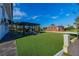 Lovely home with backyard patio covered by a pergola, and artificial turf at 2061 S Peninsula Dr, Daytona Beach, FL 32118