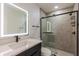 Modern bathroom with illuminated mirror, updated shower and vanity area at 2061 S Peninsula Dr, Daytona Beach, FL 32118