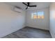 Bright bedroom features new floors, a mini-split system, and a large window with lots of natural light at 2061 S Peninsula Dr, Daytona Beach, FL 32118