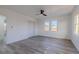 Bright bedroom with two windows and modern gray floors at 2061 S Peninsula Dr, Daytona Beach, FL 32118