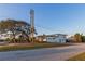 Beautiful home exterior with mature trees near a quiet neighborhood at 2061 S Peninsula Dr, Daytona Beach, FL 32118